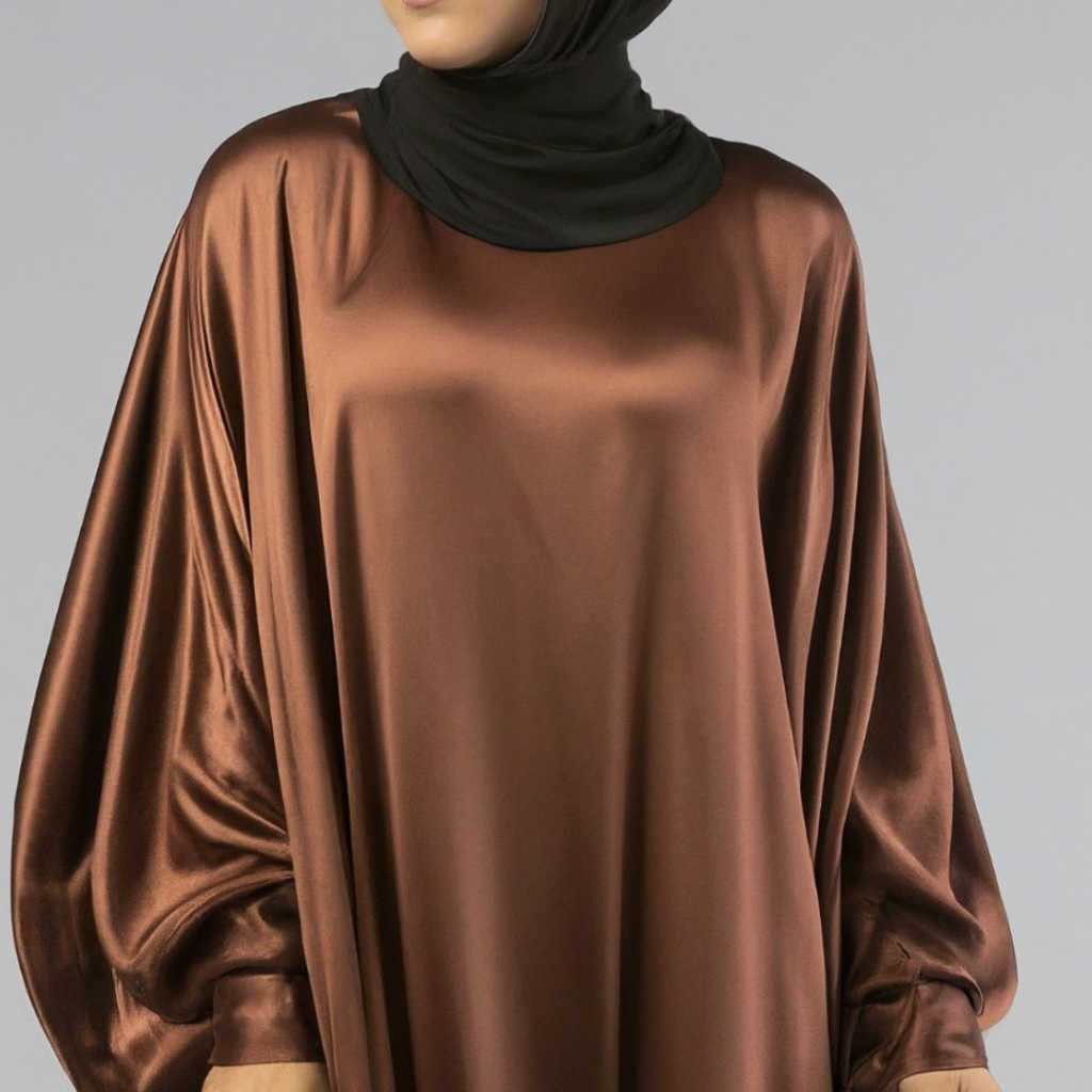 Close-up image of satin abaya to highlight its luxurious and glossy surface 